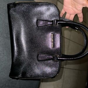 Michaels Kors leather black double zipper purse.